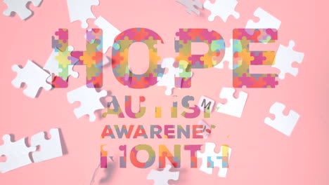 hope and autism awareness month text over jigsaw puzzle