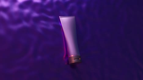 cosmetic tube on purple and pink silk background