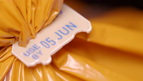 close-up of a 'use by' date on food packaging