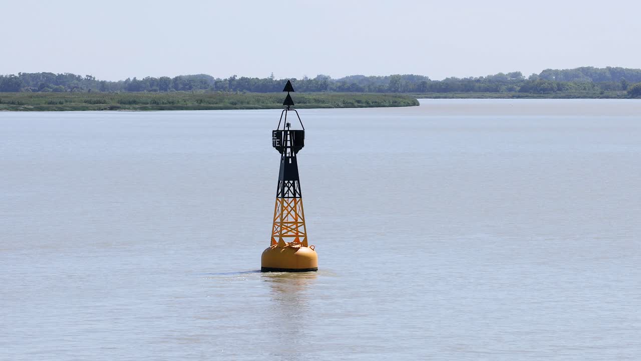 Buoy floating in calm water near Blaye, France