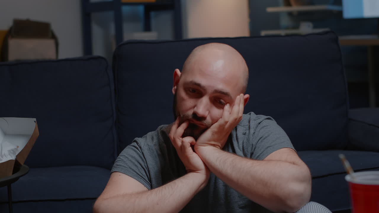 Close up of traumatized man going through a break up feeling frustration