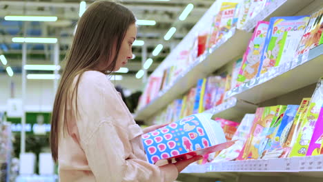 woman browsing children's books in a store