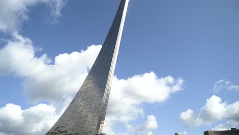 monument to cosmonautics under a partly cloudy sky