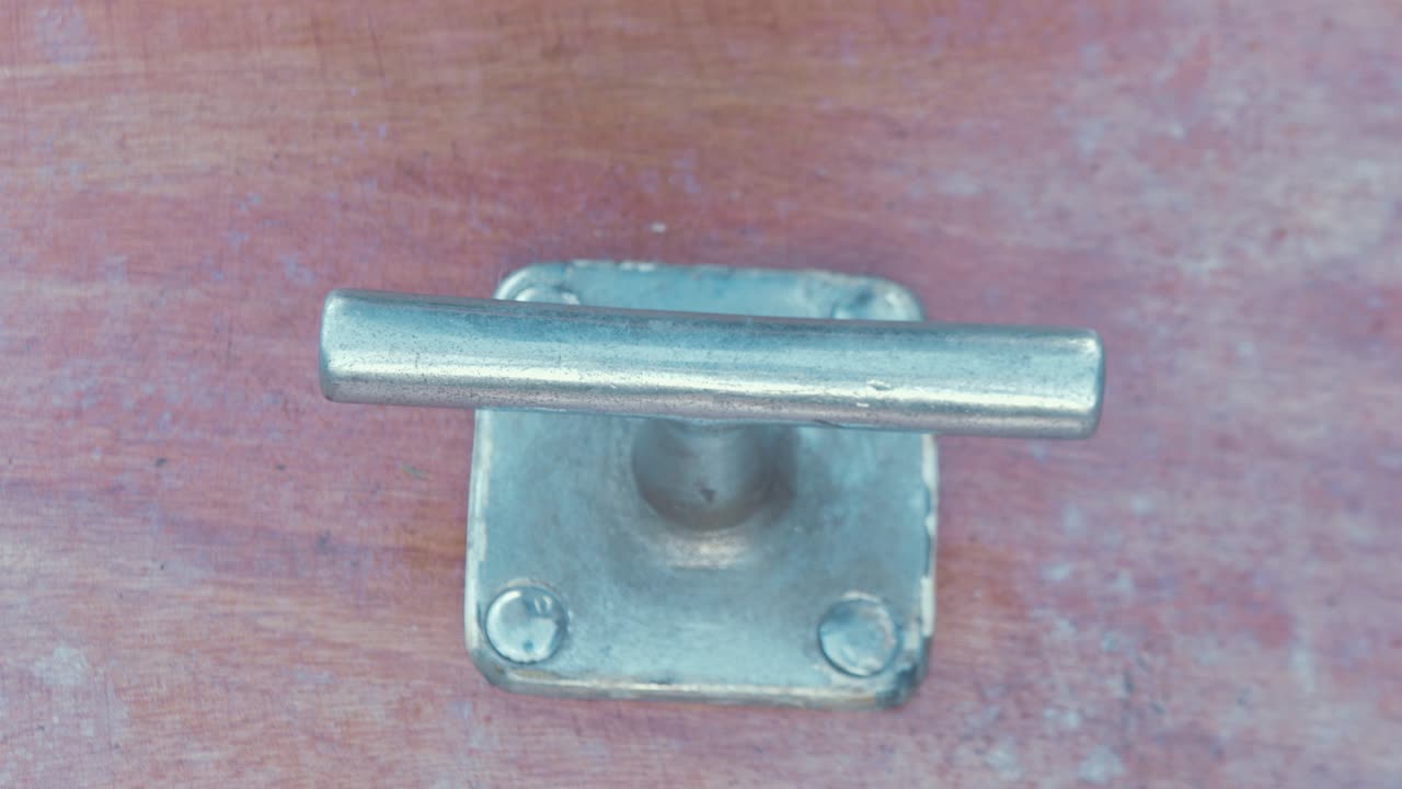 Close-up of a Rope Tied to a Cleat on a Boat