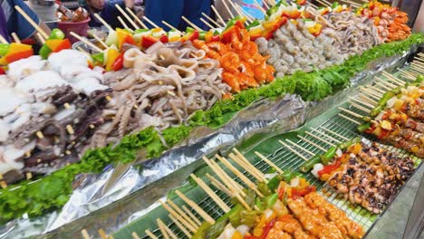 grilled seafood skewers at a street food market