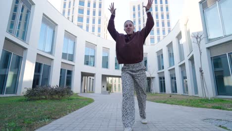 young talented energetic dancer performing modern choreography outdoors