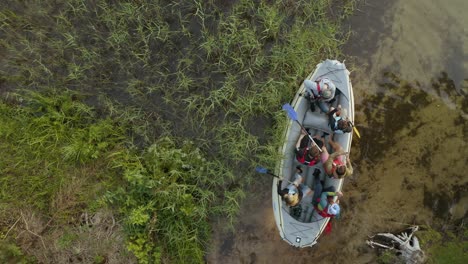 drone shot of people starting a boat ride on the lake