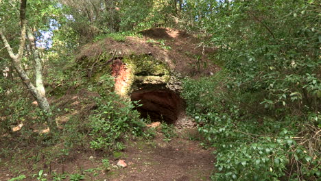 large hole in a rock in the monsanto forest park, caused by natural erosion from moisture