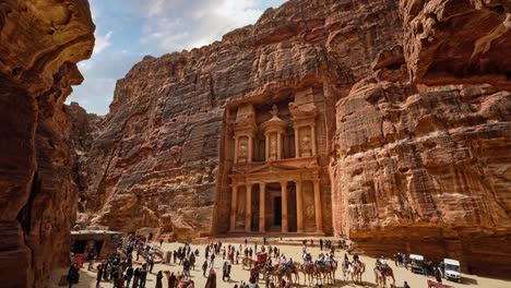 time lapse of people at petra treasury, the famous historic nabataeans unesco heritage site carved into sandstone in jordan