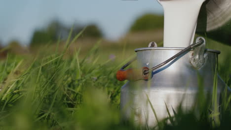 miilkman pours milk into a can