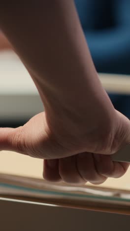 vertical video close up of office secretary pushes trolley filled with paperwork and documents