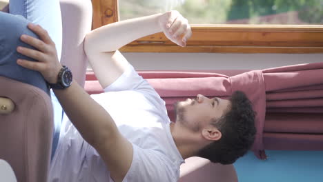 Vertical video of Man with family problems sits bored.