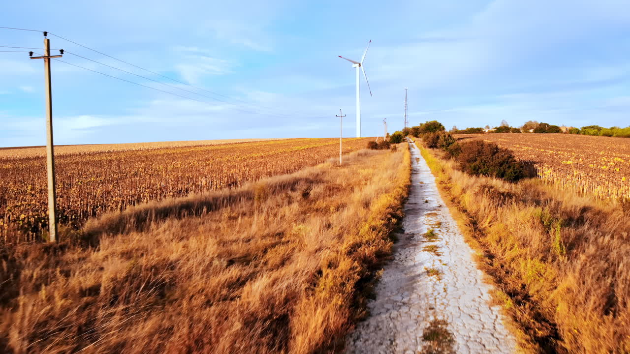 Aerial drone view of wind turbines for energy production located on a field. Windmill's power generating clean renewable energy for sustainable development. Balti, Moldova