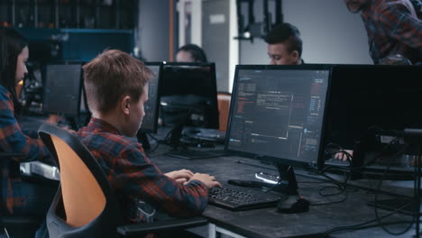 children learning to code in a computer lab