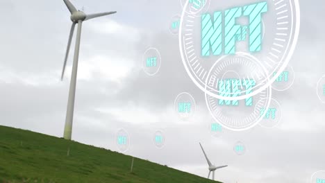 animation of nft floating over wind turbine and clouds