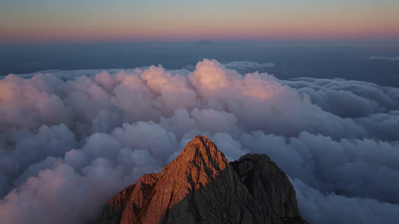 Mountain Peak Above the Clouds at Sunrise/Sunset
