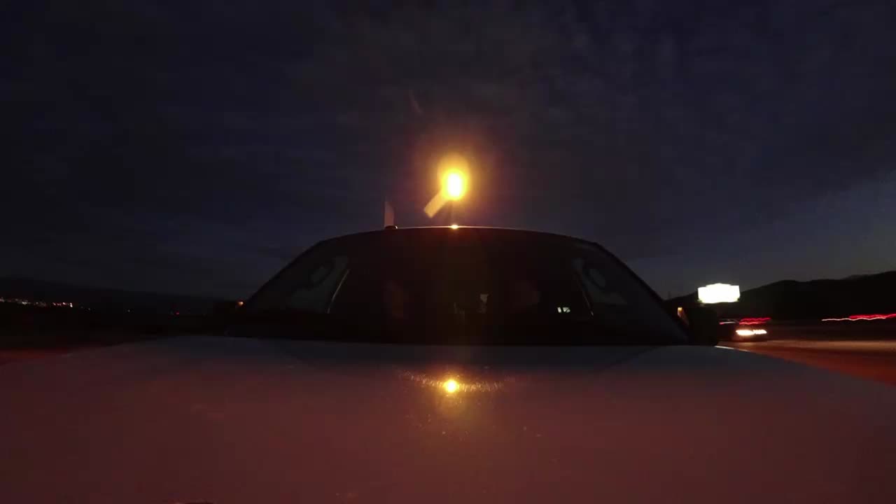 pov timelapse from hood into car with 2 persons travelling californian landscape