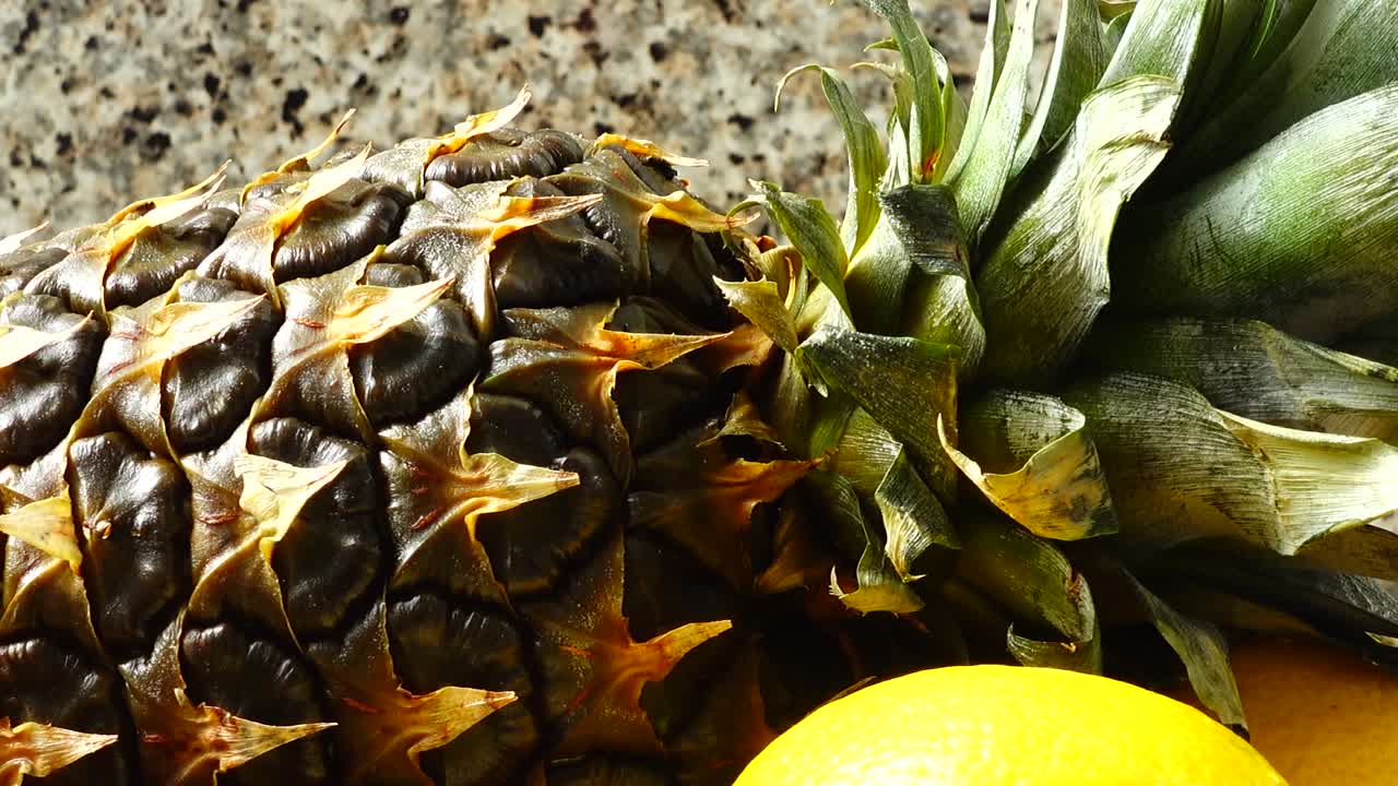 Still life from pineapple, apples and lemons. Healthy food