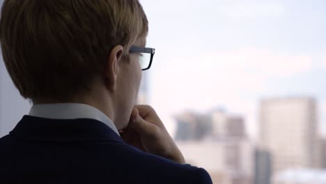 businessman looking out the window