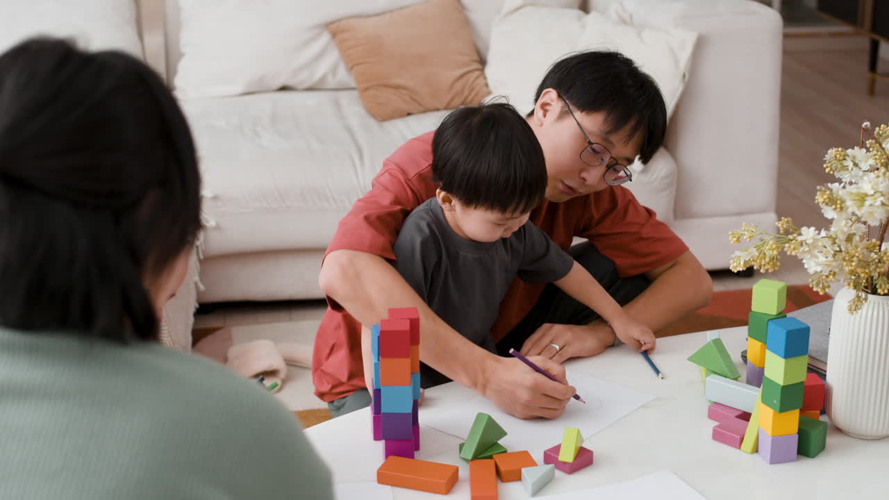 Father and Child Engaging in Educational Play