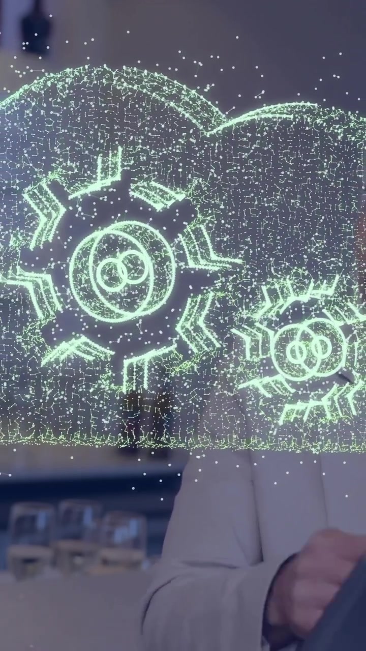 Two professionals discussing technology with cloud and gears animation overlay