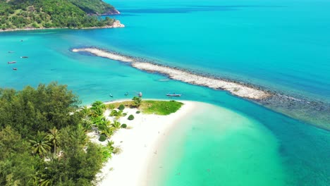 small sandbar in the turquoise waters of the thailand coast