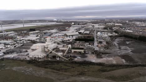 aerial view overlooking uk industrial waterfront refinery factory