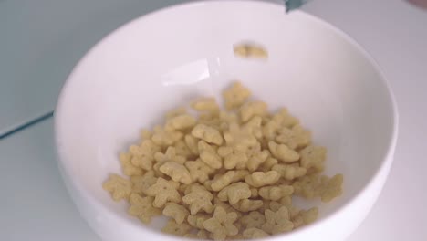 crunchy cereals in star shape falls down from packet