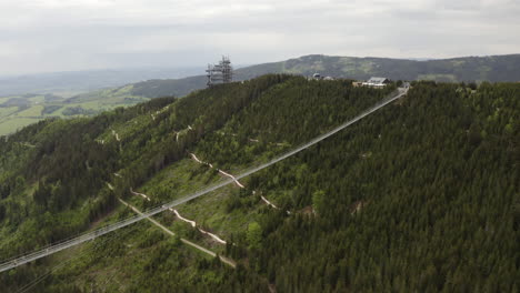 longest suspension footbridge in world above valley in moravia, drone