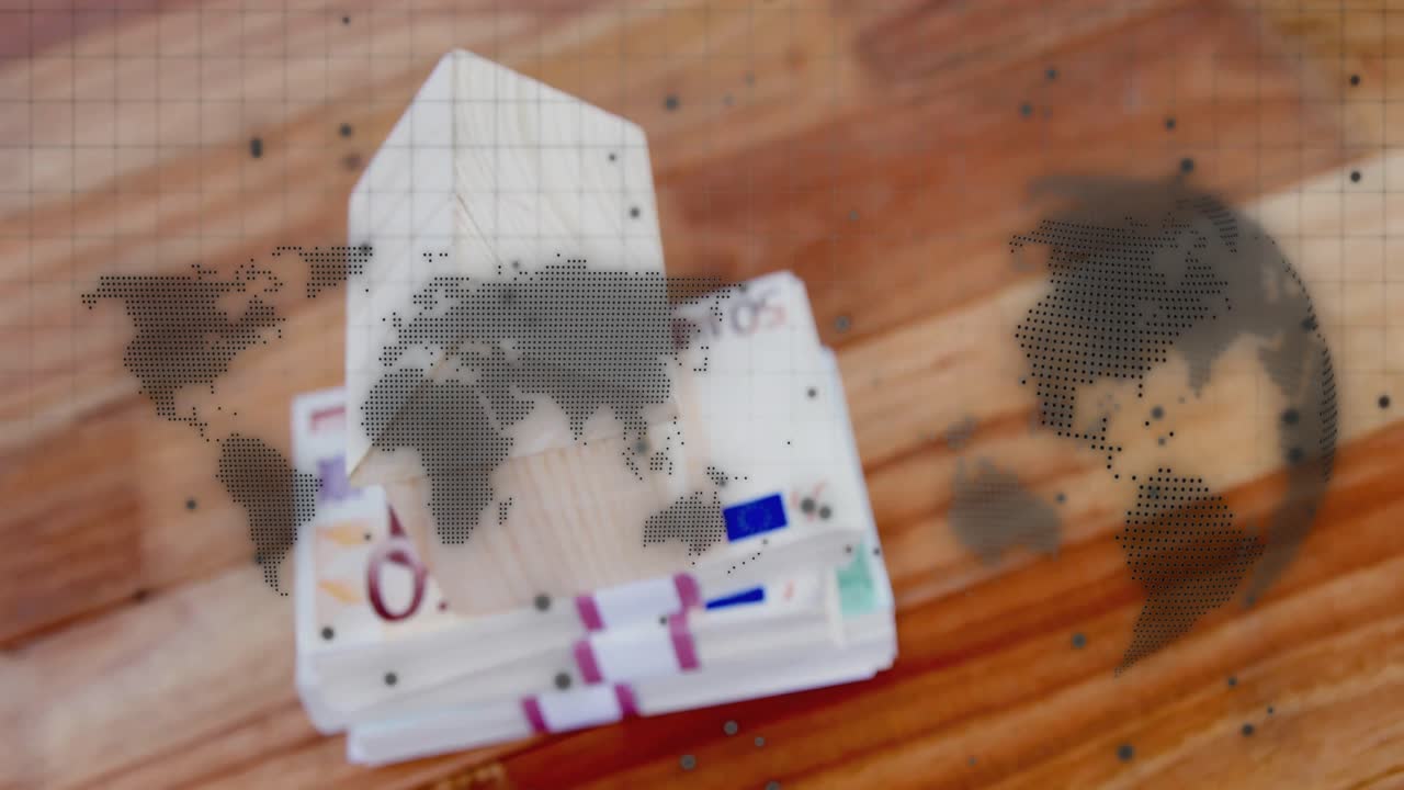 Mappa del mondo in dissolvenza su un tavolo con una mano in maniche che sventaglia banconote da 50 euro per mostrare una demo finanziaria