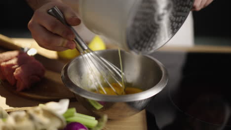preparing a meal with eggs and fresh ingredients