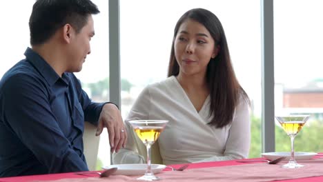 happy romantic couple eating lunch at restaurant