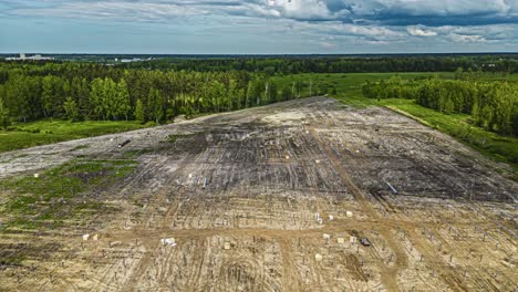 Preparing-a-field-to-install-a-solar-panel-farm---aerial-hyper-lapse