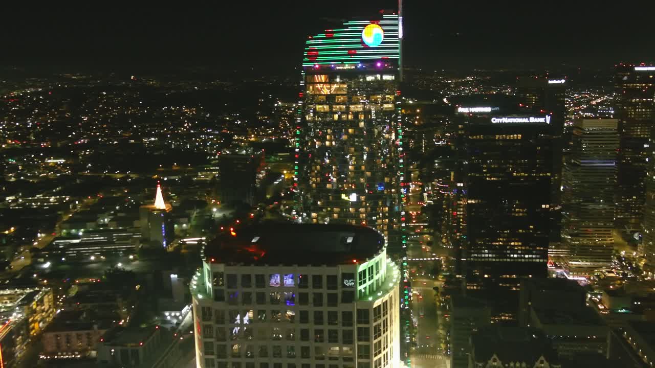 Night time Aerial Orbital shot of the Intercontinental Hotel in downtown Los Angeles (pepsi logo)