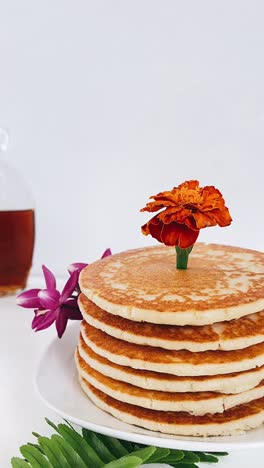 stack of pancakes with a flower