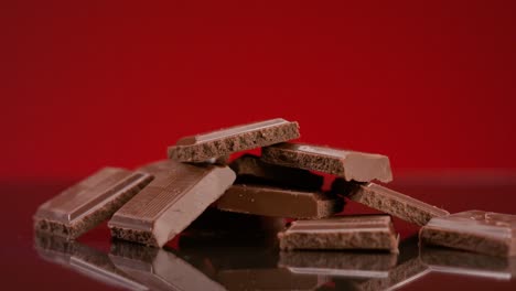 hand placing chocolate bar pieces