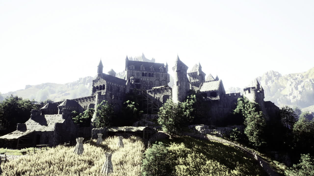 Medieval castle overlooking a rugged hillside with surrounding vegetation