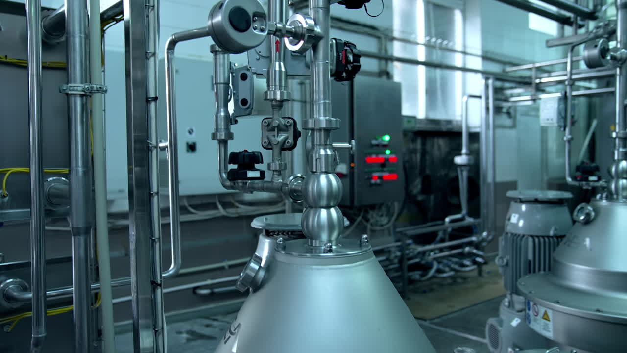 Interior of dairy factory with fermentation tank. Technology equipment at dairy farm. Sterile production