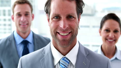 confident business team smiling at camera