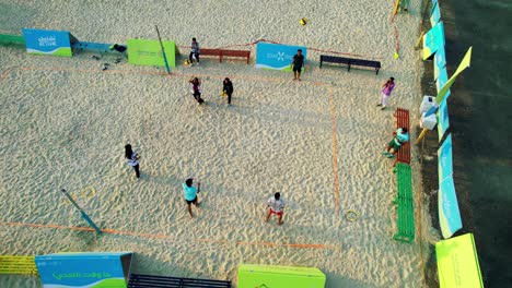 people playing volley ball on beach