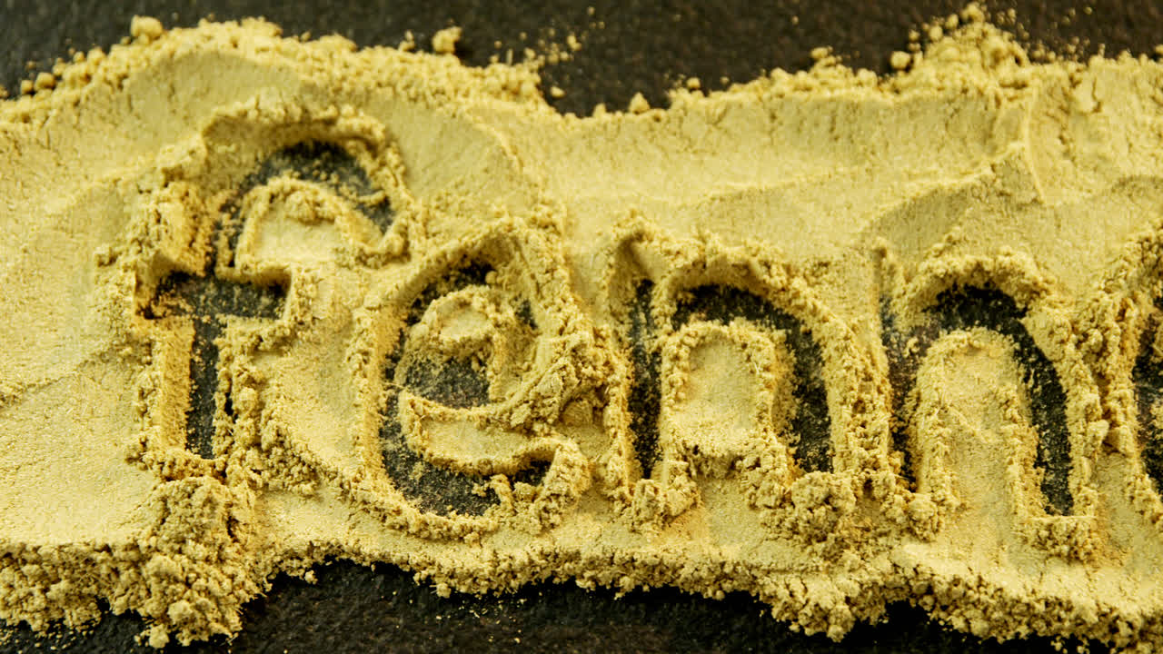 검은색 바탕에 핀 (fennel) 의 문자를 형성하는 핀 파우더 (text forming fennel powder on black background)