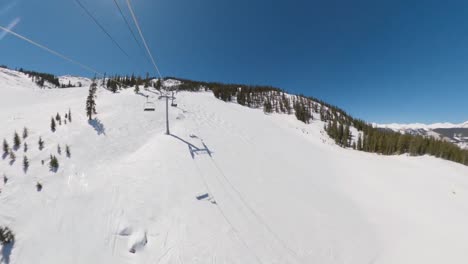 riding colorado ski lift on a bluebird day to the top, time lapse