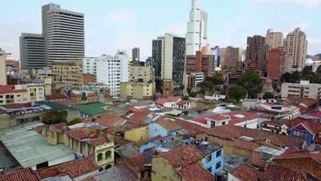 Beautiful-aerial-establishing-shot-of-old-buildings-modern-skyscrapers-and-neighborhoods-in-downtown-Bogota-Colombia