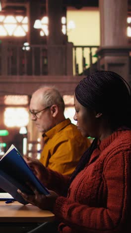 vertical video colleagues disturbing a woman with their loud reading in the library