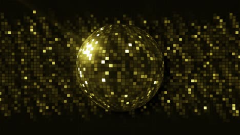 golden disco ball on a dark background