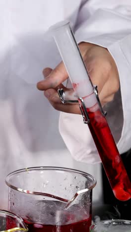 scientist conducts experiment with dry ice and chemicals