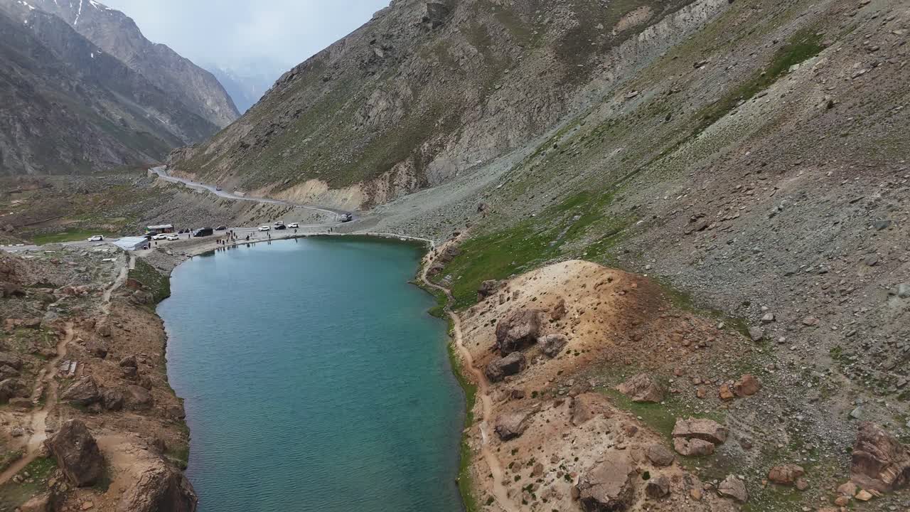 Aerial drone shot of Ladakh’s high-altitude terrain featuring dramatic ridges and deep valleys.
