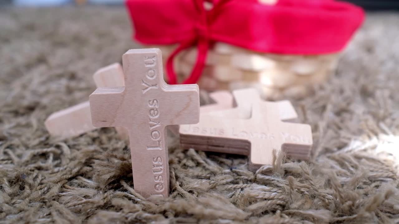wooden cross with Jesus loves you in different style of shooting techniques.