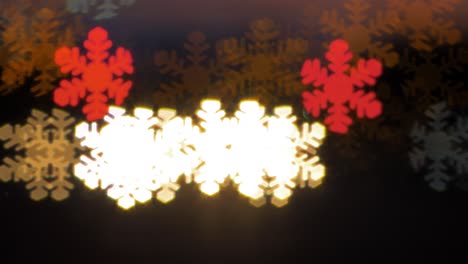 beautiful snowflake shaped bokeh from moving car and traffic lights at the evening, christmas, winter or holiday background concept, copyspace