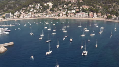 Luxurious-yachts-and-boats-anchoring-in-Port-de-Sóller-sea-harbor-bay